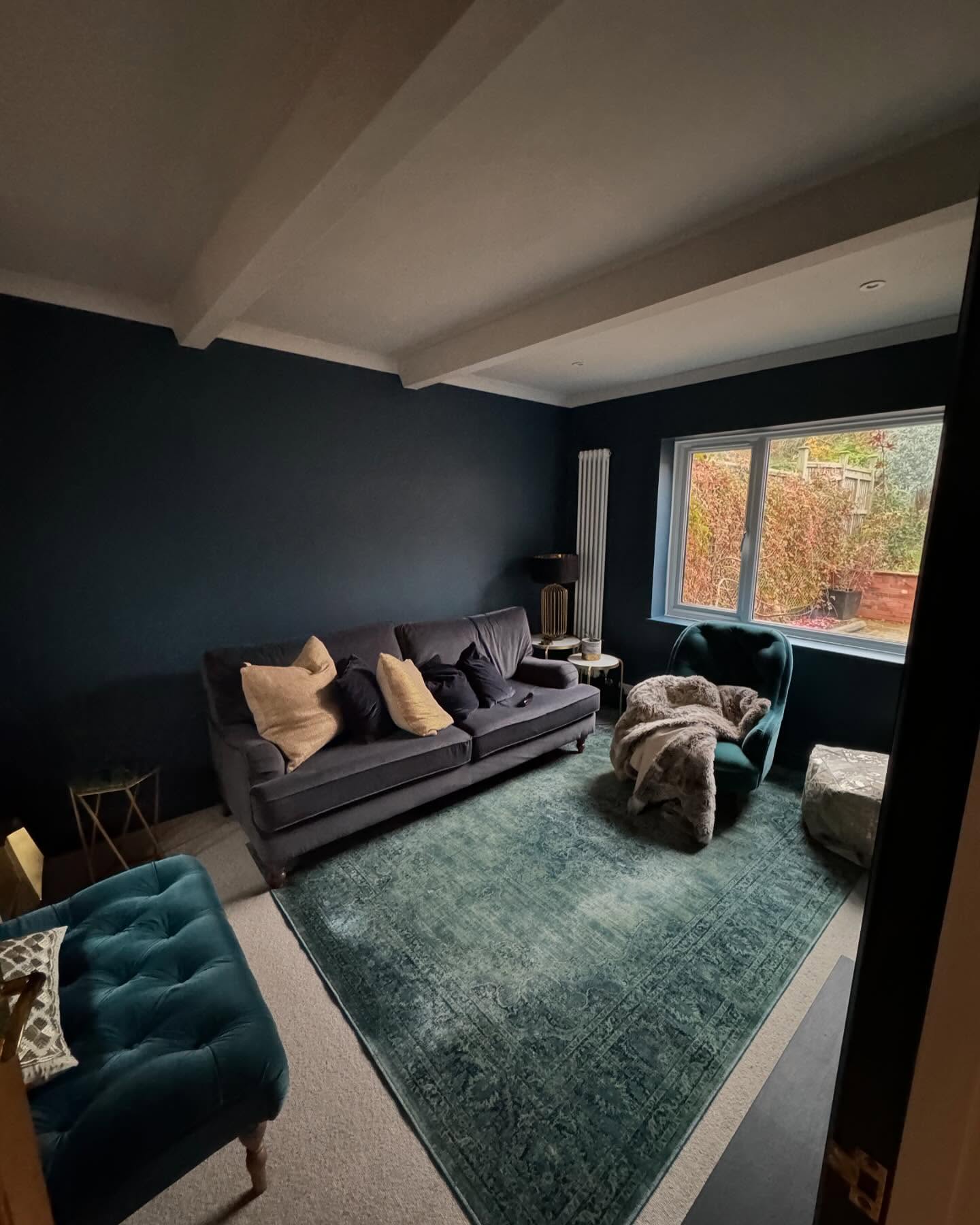 Living room painted in deep navy